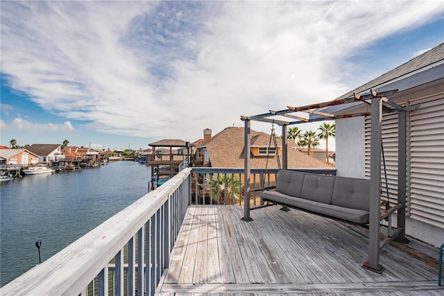 wooden deck with a water view