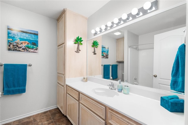 bathroom with tile patterned flooring and vanity