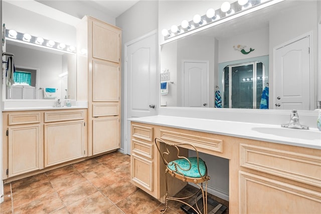 bathroom featuring tile patterned flooring and vanity