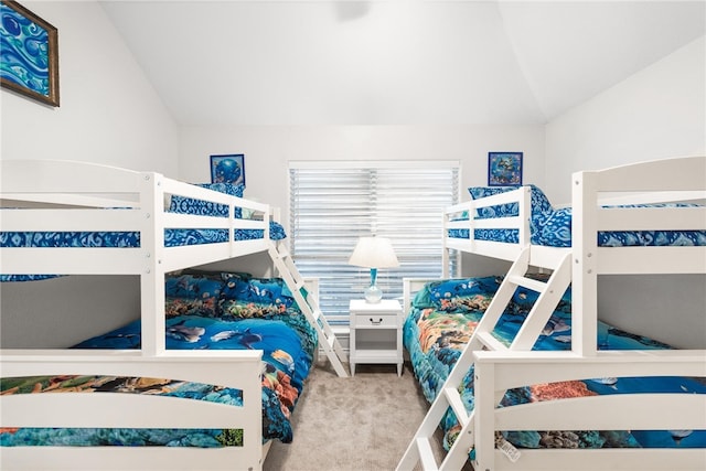 bedroom featuring carpet and lofted ceiling