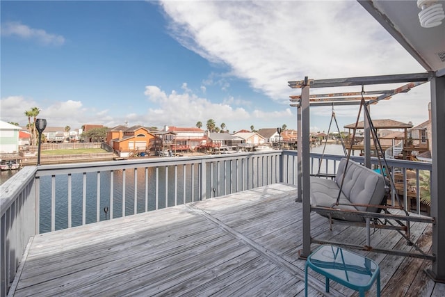 wooden terrace with a water view