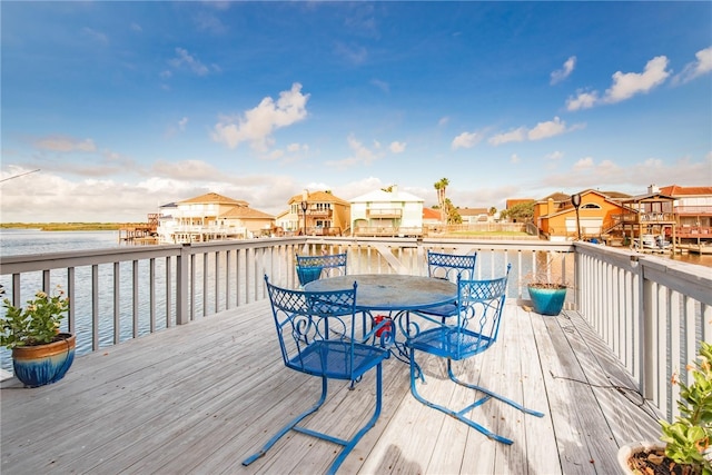 wooden deck featuring a water view