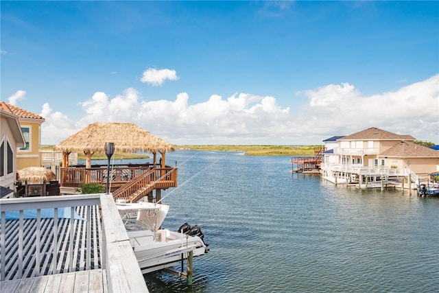 view of dock featuring a water view and a gazebo