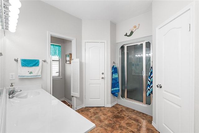 bathroom featuring vanity, an enclosed shower, and tile patterned floors