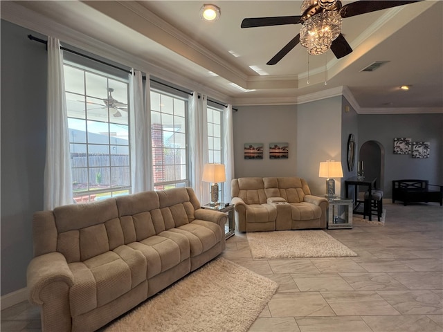 6317 Sir Jack St, Corpus Christi, TX 78414 - living area featuring a ceiling fan, arched walkways, a raised ceiling, and ornamental molding