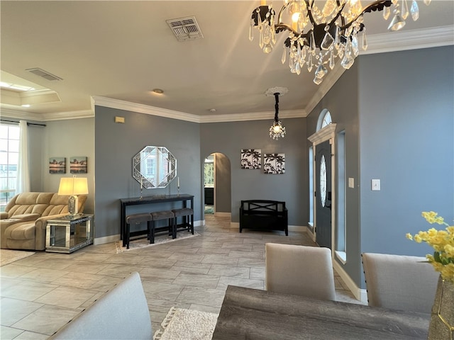 6317 Sir Jack St, Corpus Christi, TX 78414 - living room with arched walkways, crown molding, and a chandelier