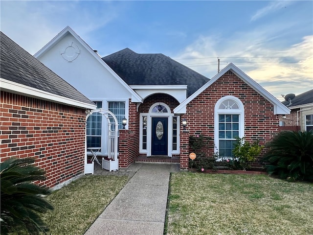 6317 Sir Jack St, Corpus Christi, TX 78414 - view of front of home featuring brick siding and a front lawn
