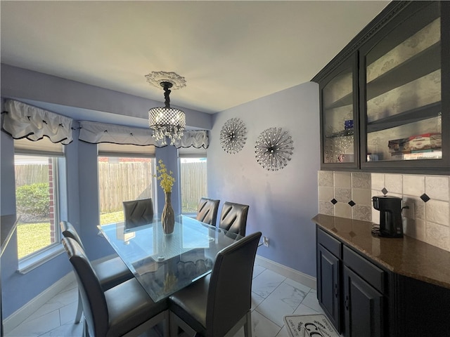 6317 Sir Jack St, Corpus Christi, TX 78414 - dining space featuring light marble finish flooring and a chandelier