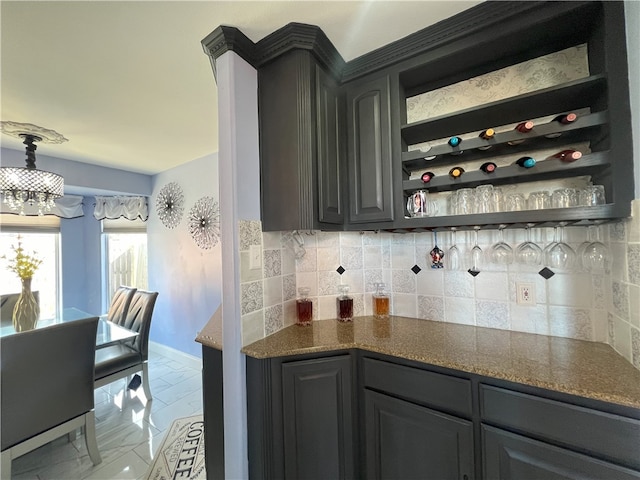 6317 Sir Jack St, Corpus Christi, TX 78414 - indoor dry bar featuring a chandelier and decorative backsplash