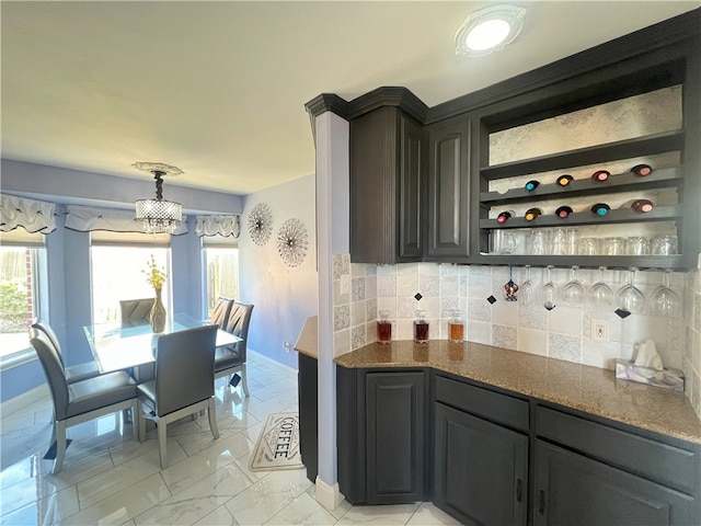 6317 Sir Jack St, Corpus Christi, TX 78414 - kitchen with light marble finish flooring, tasteful backsplash, and open shelves