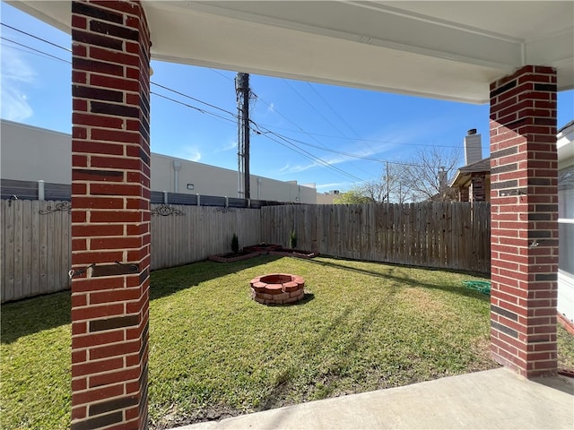 6317 Sir Jack St, Corpus Christi, TX 78414 - fenced backyard with an outdoor fire pit