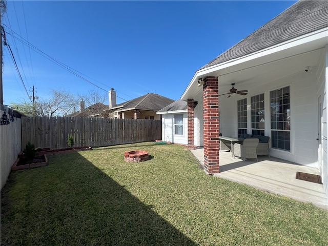 6317 Sir Jack St, Corpus Christi, TX 78414 - fenced backyard featuring a ceiling fan, an outdoor fire pit, and a patio area