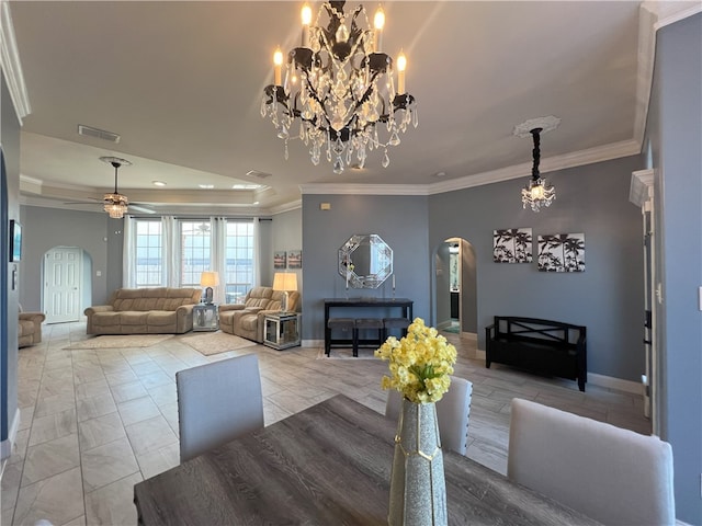6317 Sir Jack St, Corpus Christi, TX 78414 - dining room featuring arched walkways, ornamental molding, ceiling fan, a chandelier, and a tray ceiling