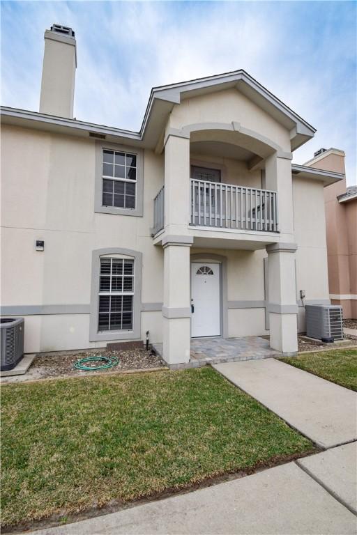14435 Compass St Unit C, Corpus Christi, TX 78418 - view of front of home featuring a balcony, cooling unit, and a front yard