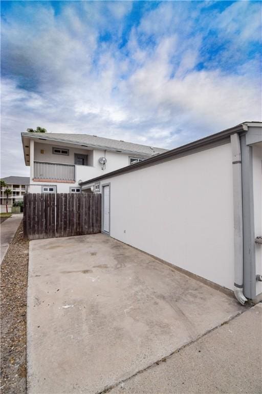 14435 Compass St Unit C, Corpus Christi, TX 78418 - view of property exterior featuring fence and stucco siding