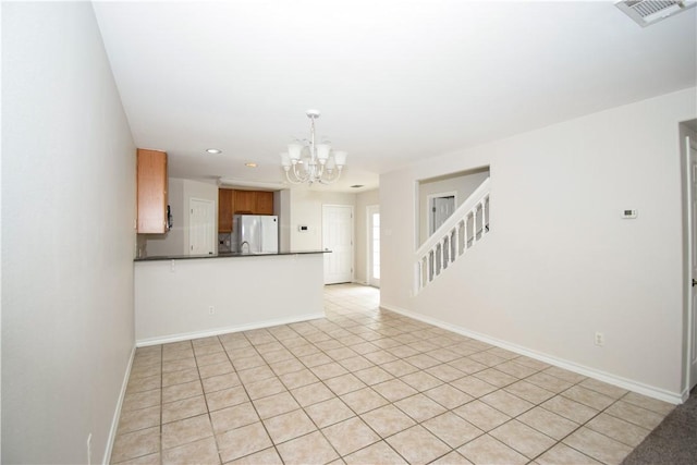 14435 Compass St Unit C, Corpus Christi, TX 78418 - unfurnished living room featuring a chandelier, baseboards, recessed lighting, and light tile patterned flooring