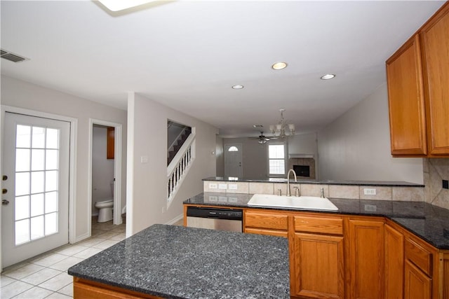 14435 Compass St Unit C, Corpus Christi, TX 78418 - kitchen featuring a sink, a peninsula, dishwasher, brown cabinets, and recessed lighting