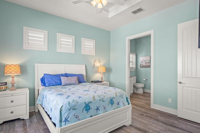 bedroom featuring dark hardwood / wood-style flooring, connected bathroom, and ceiling fan