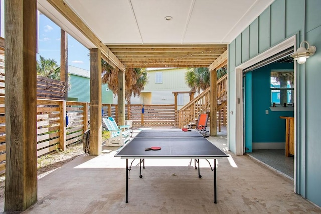 game room with concrete floors