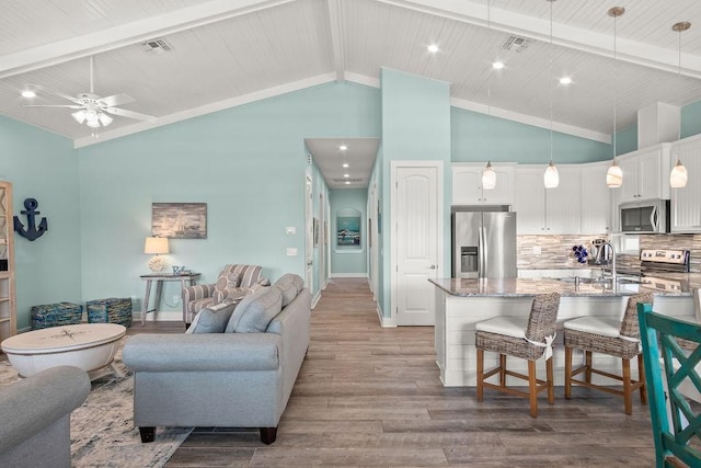 living room featuring sink, high vaulted ceiling, light hardwood / wood-style floors, and ceiling fan