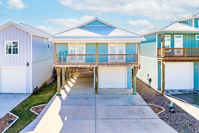 view of front of property with a garage, french doors, and a balcony