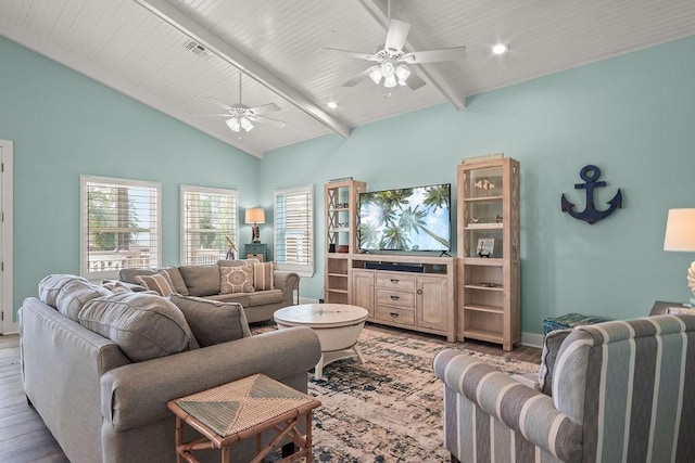 living room featuring vaulted ceiling with beams, ceiling fan, and light hardwood / wood-style flooring