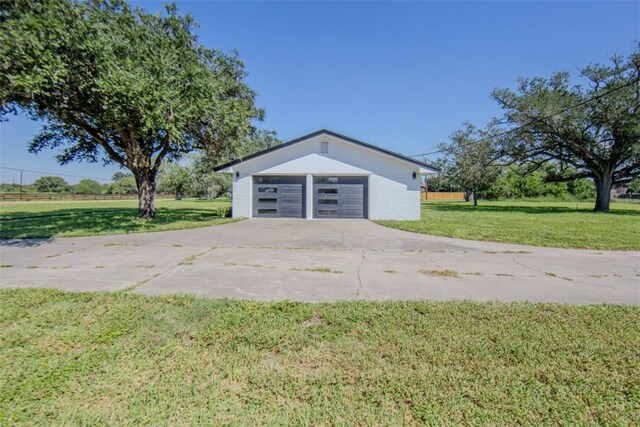 garage featuring a yard