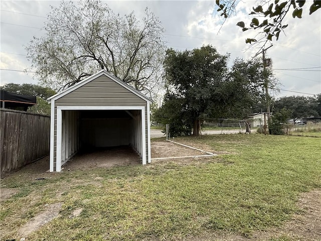 garage with a lawn