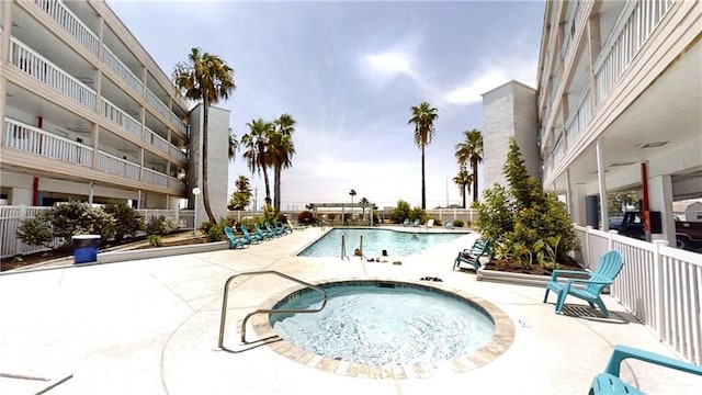 3938 Surfside Blvd Unit 1206, Corpus Christi, TX 78402 - community pool with a community hot tub, a patio area, and fence