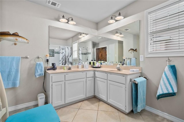 bathroom featuring tile patterned floors, a shower with curtain, and vanity