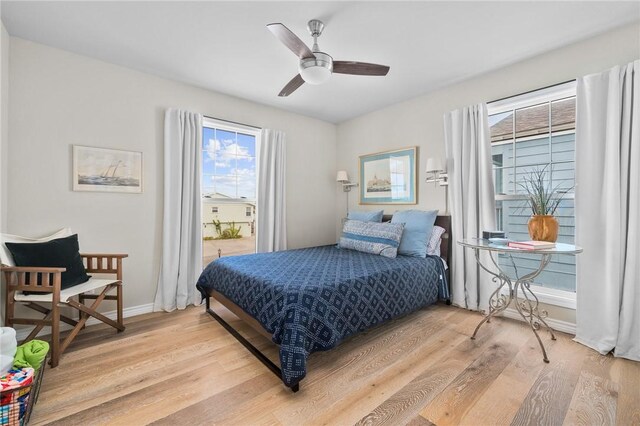 bedroom featuring ceiling fan and light hardwood / wood-style floors