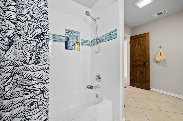 bathroom with tile patterned floors and shower / bathtub combination with curtain