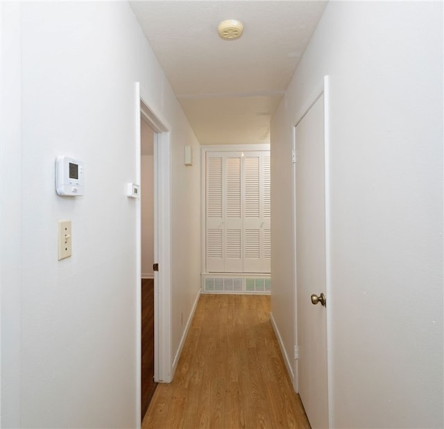 corridor featuring light hardwood / wood-style flooring