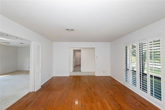 spare room featuring hardwood / wood-style floors