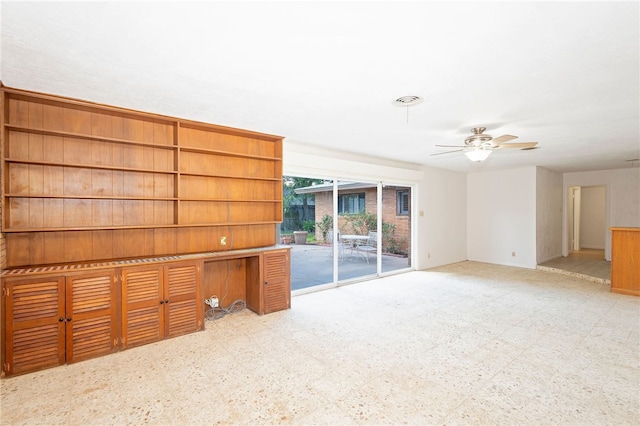 unfurnished living room with ceiling fan