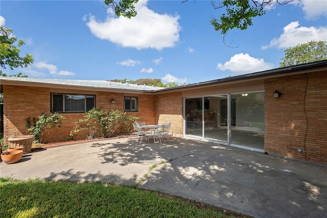 back of house with a patio