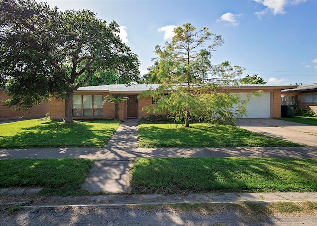 ranch-style house featuring a garage and a front lawn