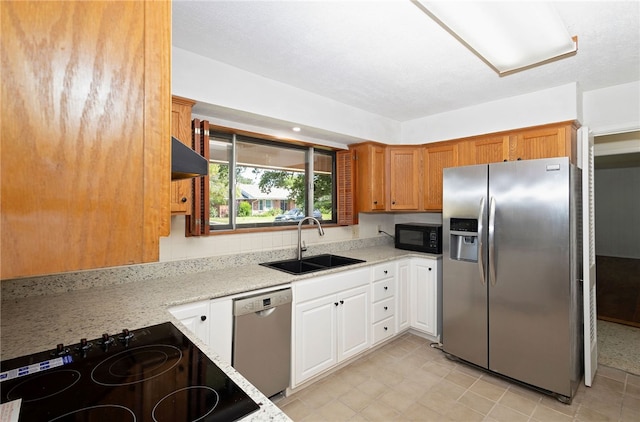 kitchen featuring white cabinets, light stone countertops, sink, and black appliances