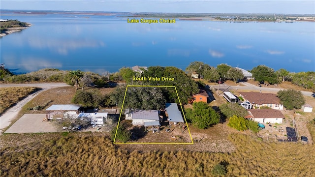 birds eye view of property with a water view