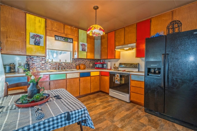 kitchen featuring black fridge, sink, backsplash, hanging light fixtures, and electric stove