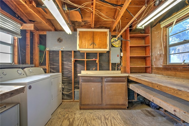 basement featuring a workshop area and washer and dryer