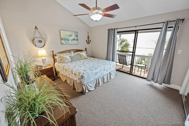 carpeted bedroom with access to outside, ceiling fan, and lofted ceiling