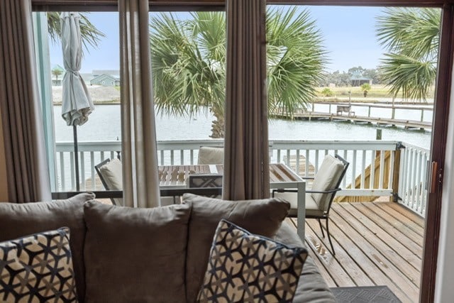 interior space with a water view and wood-type flooring