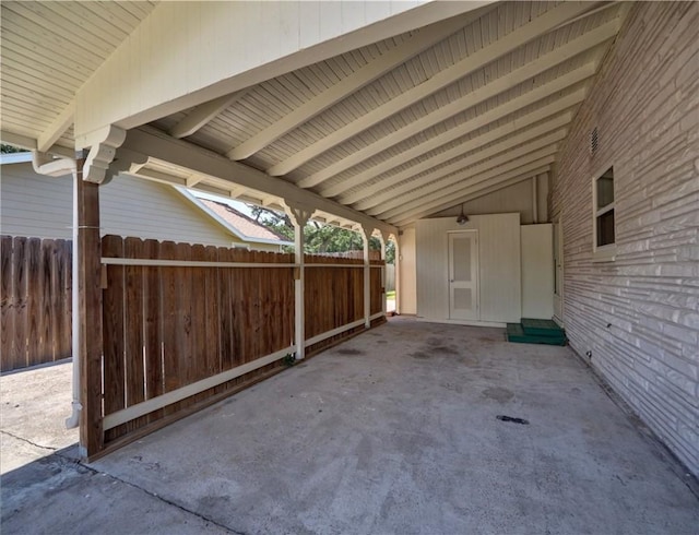 442 W Yoakum Ave, Aransas Pass, TX 78336 - view of patio / terrace with fence and a carport
