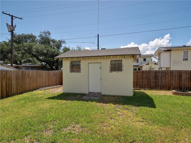 view of outdoor structure featuring a yard