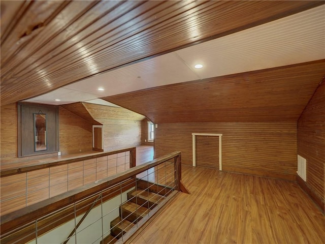 bonus room featuring wood walls, wood ceiling, and lofted ceiling