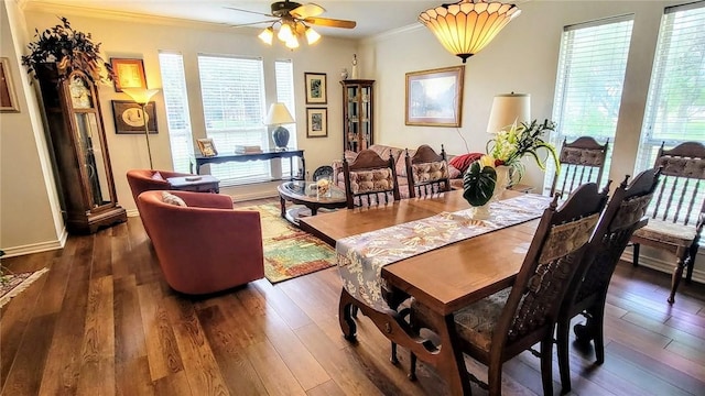 1017 Hickory Ave, Rockport, TX 78382 - dining room with ornamental molding, plenty of natural light, a ceiling fan, and dark wood finished floors
