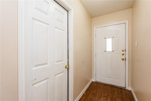 entryway with baseboards and dark wood-style floors