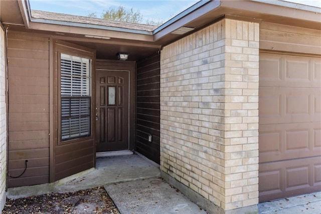 property entrance with a garage