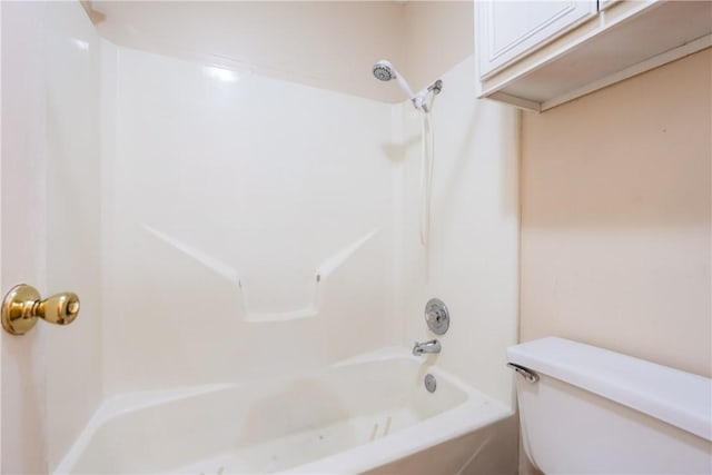 full bathroom featuring tub / shower combination and toilet